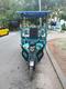 Transporte de carga y pasajeros en triciclo eléctrico 
